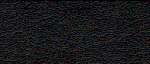 A close-up of a rough, dark textured surface with irregular patterns.