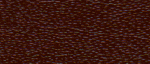 Close-up of a textured brown surface with small lighter specks.