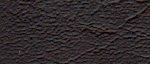 Close-up of textured dark brown surface with irregular patterns.
