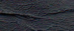Close-up of textured black leather surface.