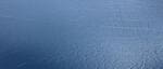 Calm blue ocean with gentle ripples.