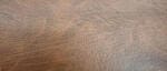Wood grain texture with brown tones.